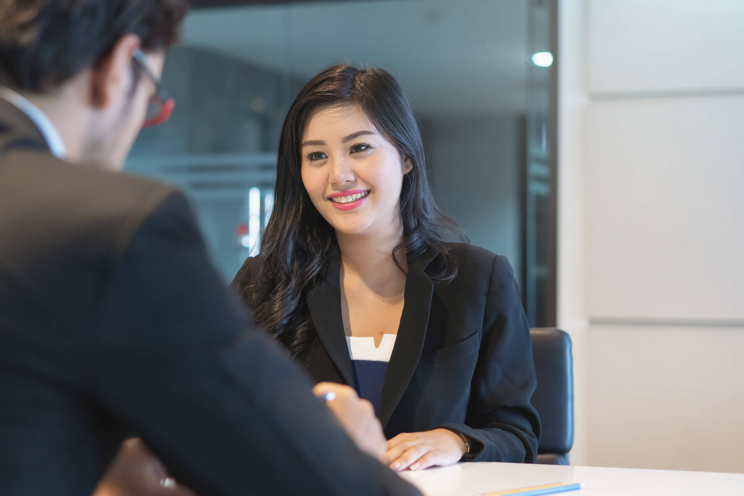 Asian woman answering question interview during job application.