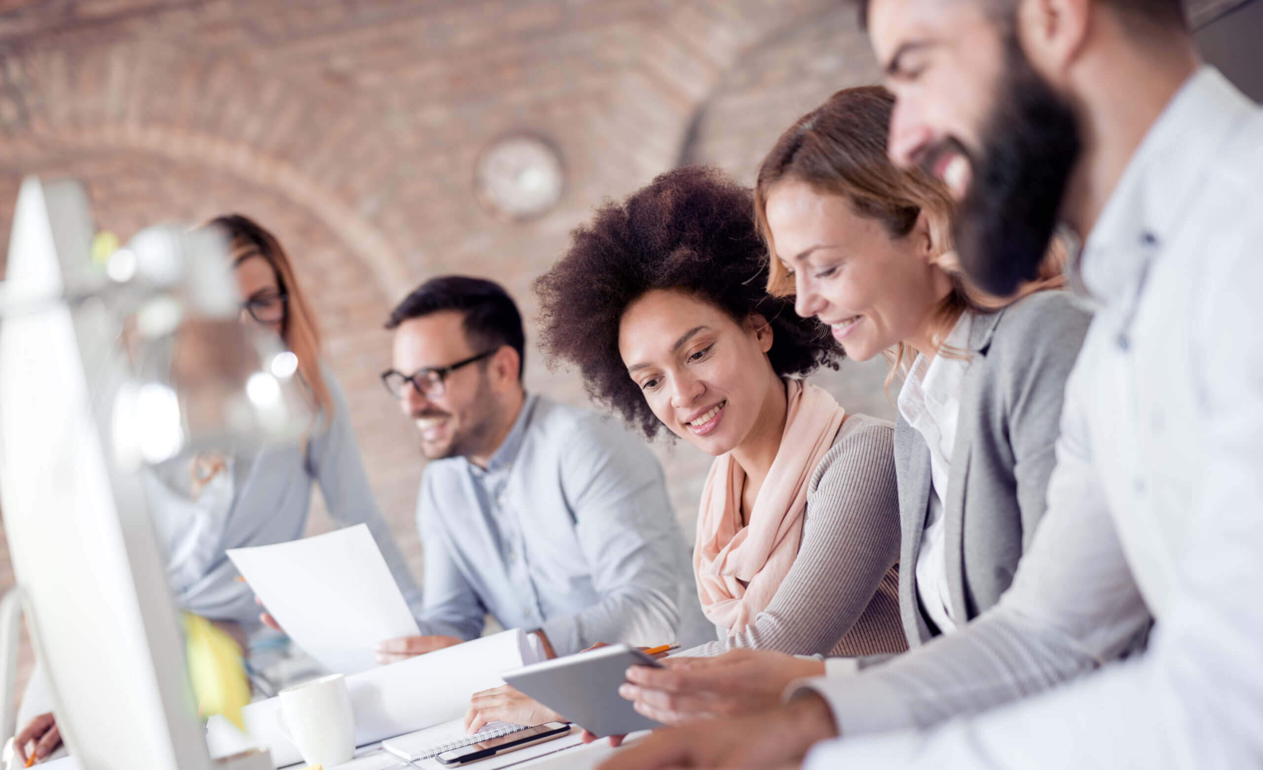 Group of young business people working together