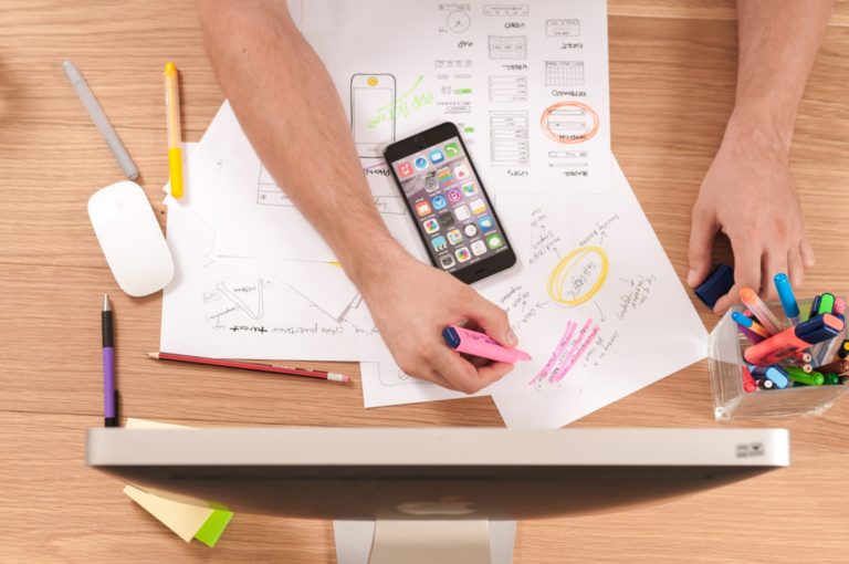 Arm and hand working at desk, highlighting important info