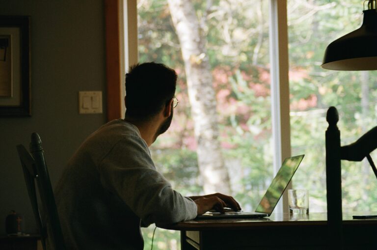 Man at desk undergoing remote work