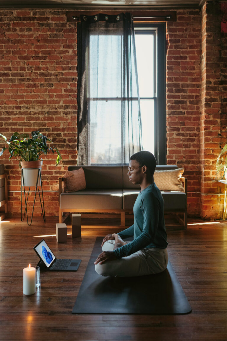 A person meditating while working to get things done even when he is not in the mood