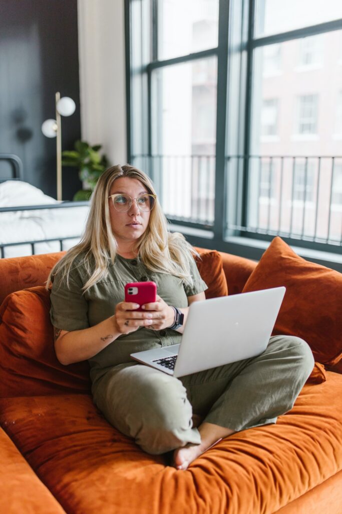 Woman procrastinating on sofa